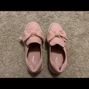Pink bow platform slip- on shoes.